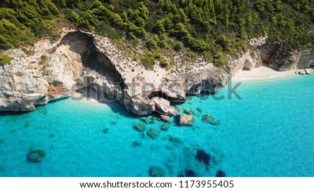 Aerial drone bird's eye view photo of small sandy hidden beach between iconic beach of Milos and Kathisma in island of Lefkada, Ionian, Greece