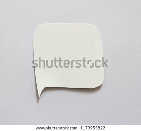Blank speech bubble on white paper background
