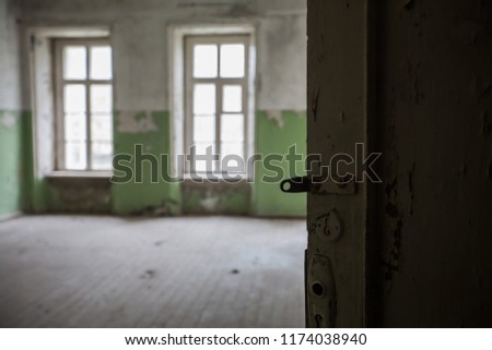 interior of an old abandoned mansion, rooms are abandoned by people, a lot of garbage, old furniture and antiquities destroyed, rooms need repair, old dust and dirt stairs, windows, door to the estate