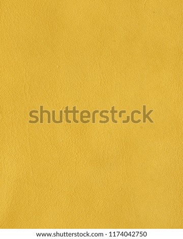 Ocher yellow leather texture background