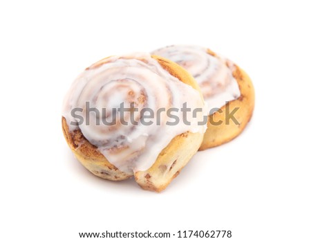Two Frosted Cinnamon Rolls on a White Background