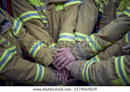 "We can, we will, we must. Members of the fire department clash their hands and show that they are a strong group