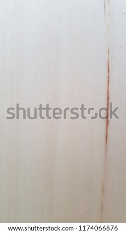 Zooming on very light wood with a dark brown crack