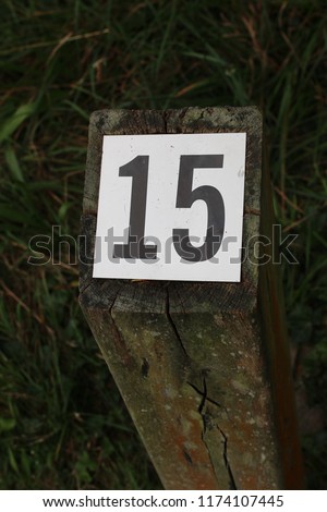 Guide number post for information trail 15