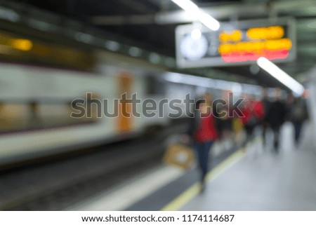 (Barcelona, Catalonia - November 11, 2016) - Defocused silhouettes of passengers on an underground platform, waiting for the arrival of the train.