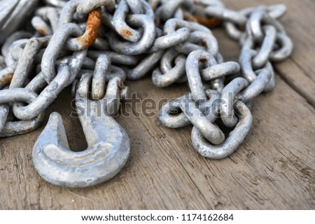 A close up image of an industrial tow chain. 