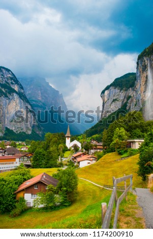 Great view of beautiful UNESCO waterfall Staubbach in Lauterbrunnen village. Amazing, famous turistic town during the sunny day. Swiss Alps, Bernese Oberland in the canton of Bern, Switzerland, Europe Royalty-Free Stock Photo #1174200910