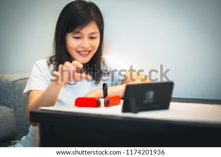 Girl playing Game at home