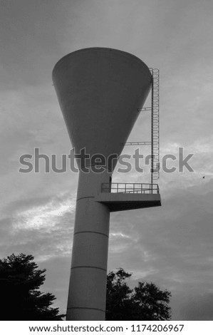 Water tank on background cloud and sky.