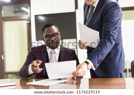 African american man signing contract, black man hand putting signature on official document, biracial clients customers couple make purchase or sign prenuptial agreement concept