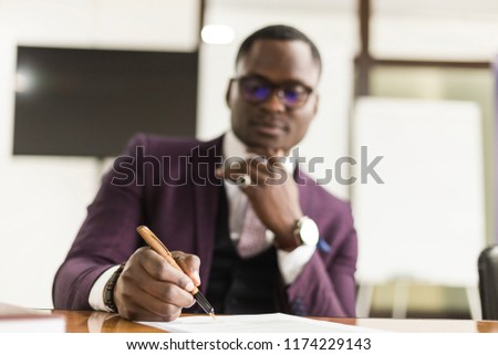 African american man signing contract, black man hand putting signature on official document, biracial clients customers couple make purchase or sign prenuptial agreement concept