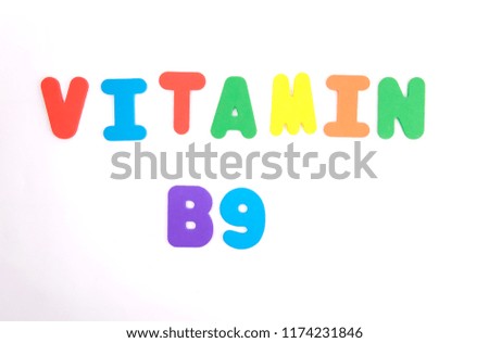 the text "Vitamin B9" colored letters on a white background. vitamins.