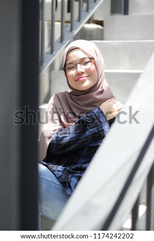 Beautiful young Asian girl wearing hijab pose at outdoor.