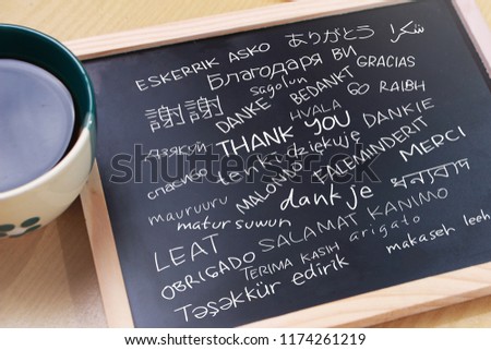 Thank you gratutide words letter in many languages, written on blackboard. Motivational business typography quotes concept 