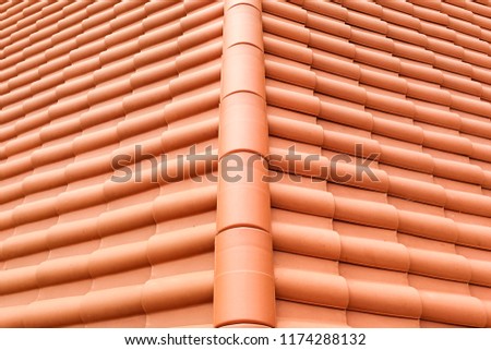 Closeup of new red color clay ceramic roof on building