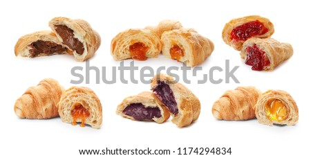 Set with fresh tasty croissants and different fillings on white background Royalty-Free Stock Photo #1174294834