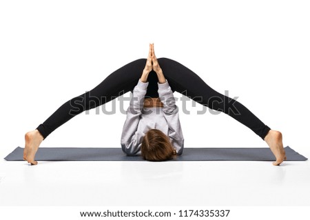 Woman doing yoga. Isolated over white