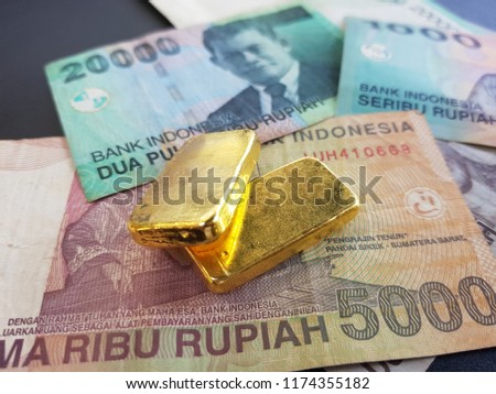 Gold bars and banknotes The Indonesian exchange rate is used for the background of the website / banner background.