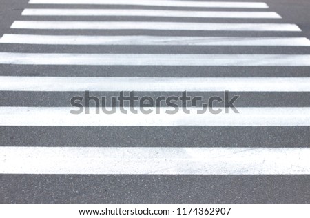 background of pedestrian stripes on asphalt