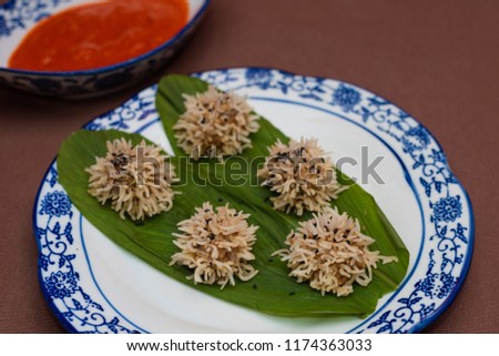 Chicken flower dumplings/Chicken Porcupine- Chicken mince balls covered with soaked rice and steamed and served with red chilly sauce