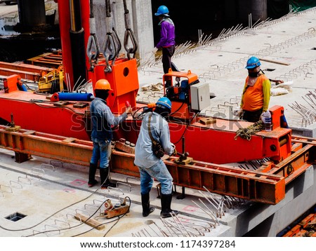 construction workers assembly the segment of sky train conctruction railway project, Royalty-Free Stock Photo #1174397284