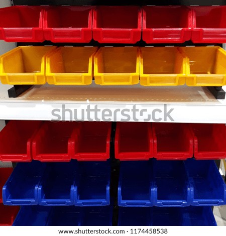 Colorful containers used to store building materials.