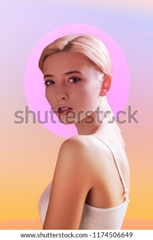 Female beauty. Attractive good looking woman turning to you while standing against gradient background