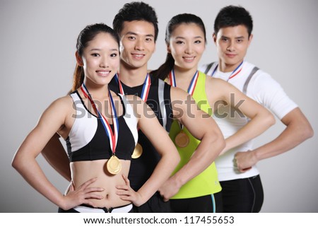 Group of young athletes holding trophy