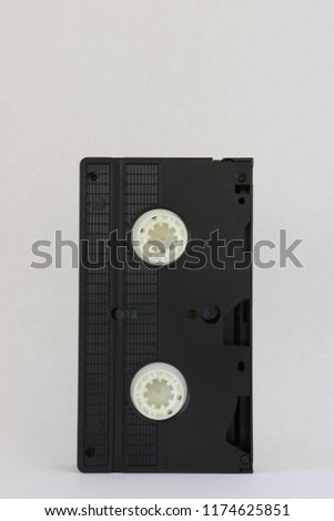 Black VHS tape on a white background