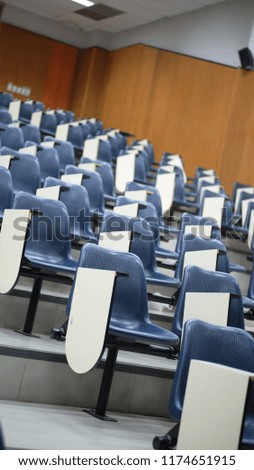 Row table-chairs in a slope room