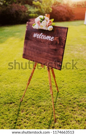 Wooden board with welcome sign. Celebration can start.