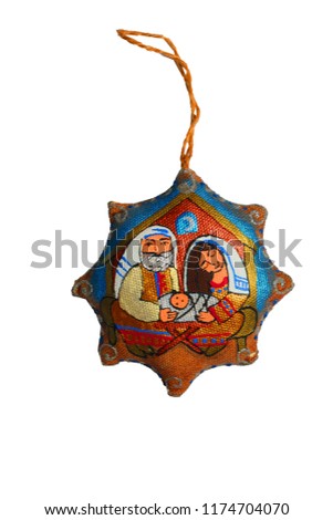 
a Christmas tree decoration with a picture of the Virgin Mary, Joseph and the baby Jesus Christ on white isolated background