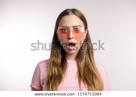 emotoional young fashion woman says Oh, no! . stunned, fascinated glamour girl with opened mouth. surpise, wonder, astonishment concept. isolated white background Royalty-Free Stock Photo #1174711084