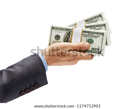 Man's hand in suit giving bundles of money isolated on white background. High resolution product. Close up