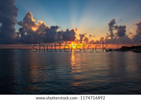 Isla Mujeres (Cancùn), Mexico, 08.24.2018: tropical sunset with a cloudy sky.