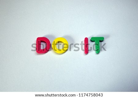 DO IT written from colorful 3D foam letters on white background
