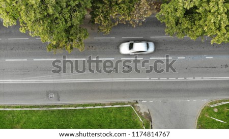 Aerial view of the road and car. View of the road. Aerial view of the car.