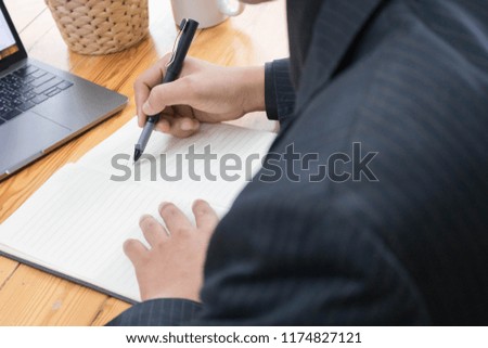 man  uses a laptop and writes