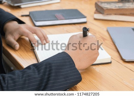 man  uses a laptop and writes