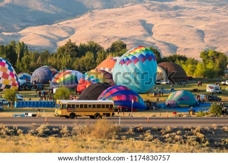 Hot air balloons taking off in a beautiful blue clear sky
