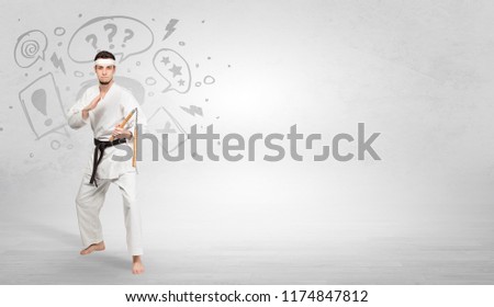 Young kung-fu trainer fighting with doodled symbols concept