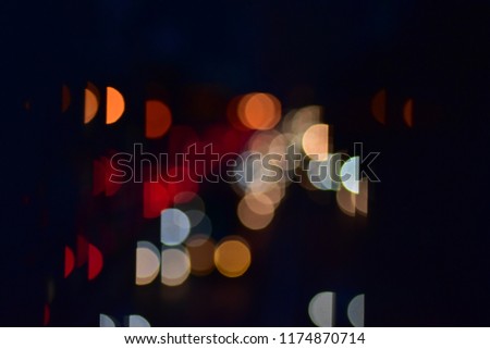Bokeh cars in city at time night town circles colorful
