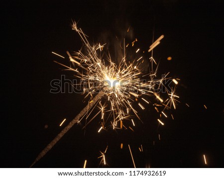 sparks of burning pyrotechnics on a black background