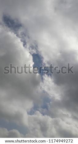 fluffy clouds in blue sky 