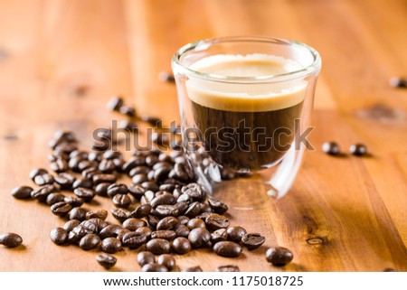 Espresso and roasted coffee beans.