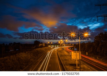 Speed traffic on motorway highway at night. 