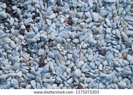 Little White Minerals Rocks  Background. Gravel Stones at sunny day. Decorative elements on the street