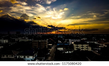 Silhouette picture of booming sky light over the city.