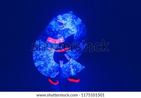 Dancer in suit with LED lamps. Night club party.