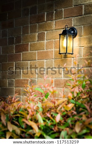 Vintage brick wall and light hanging on the wall